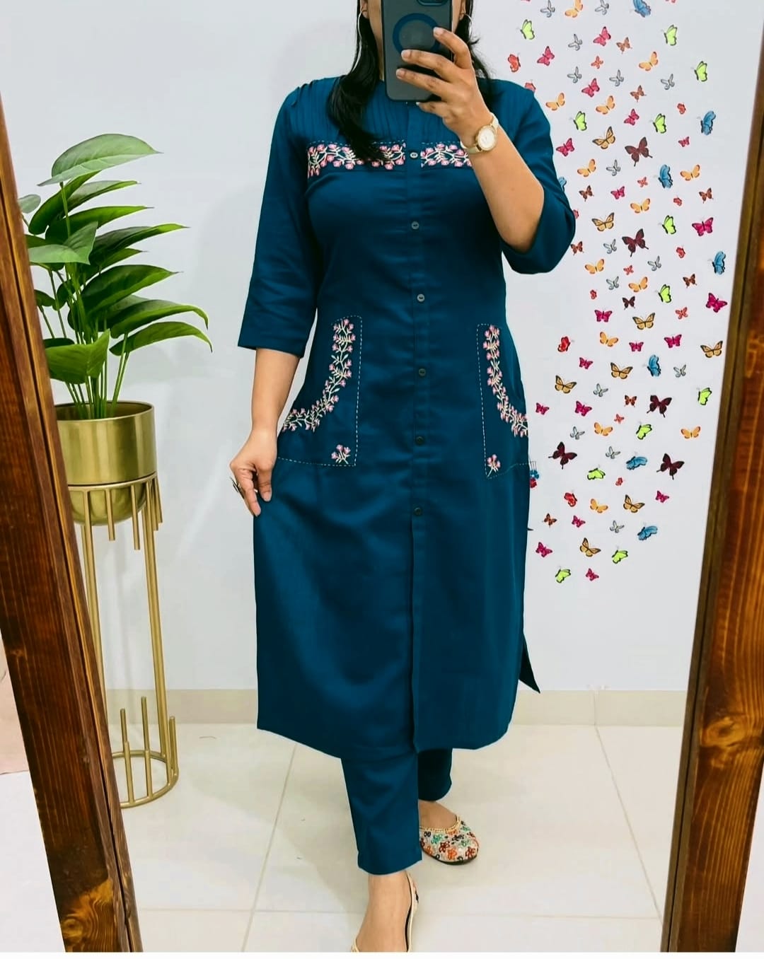 teal blue straight-cut kurti set with floral pocket embroidery