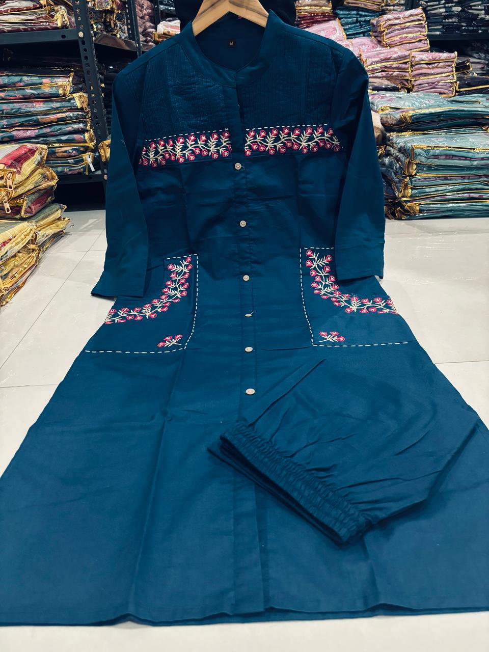 teal blue straight-cut kurti set with floral pocket embroidery