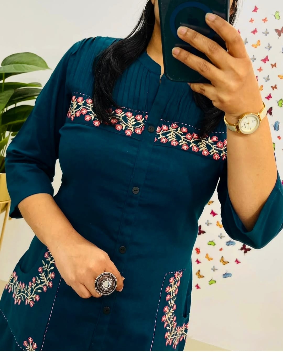 teal blue straight-cut kurti set with floral pocket embroidery