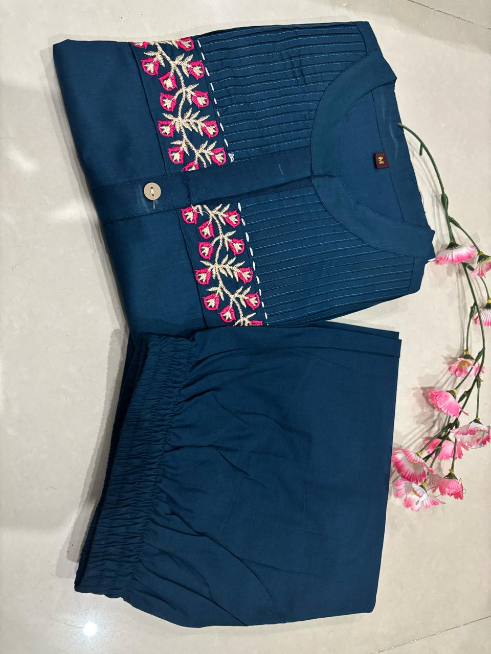 teal blue straight-cut kurti set with floral pocket embroidery