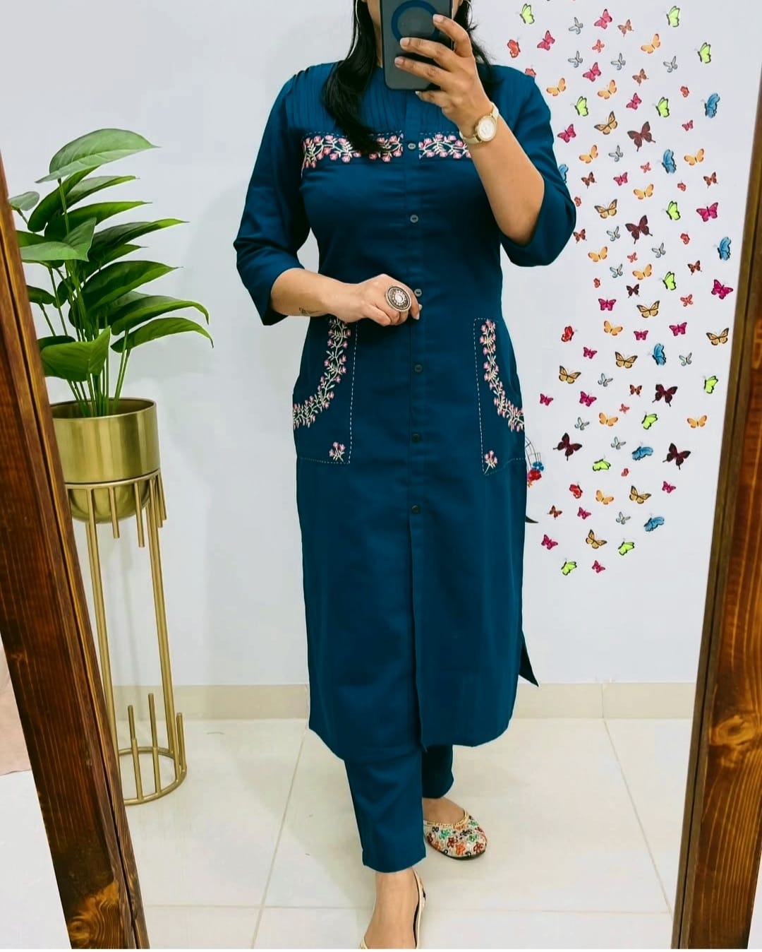teal blue straight-cut kurti set with floral pocket embroidery